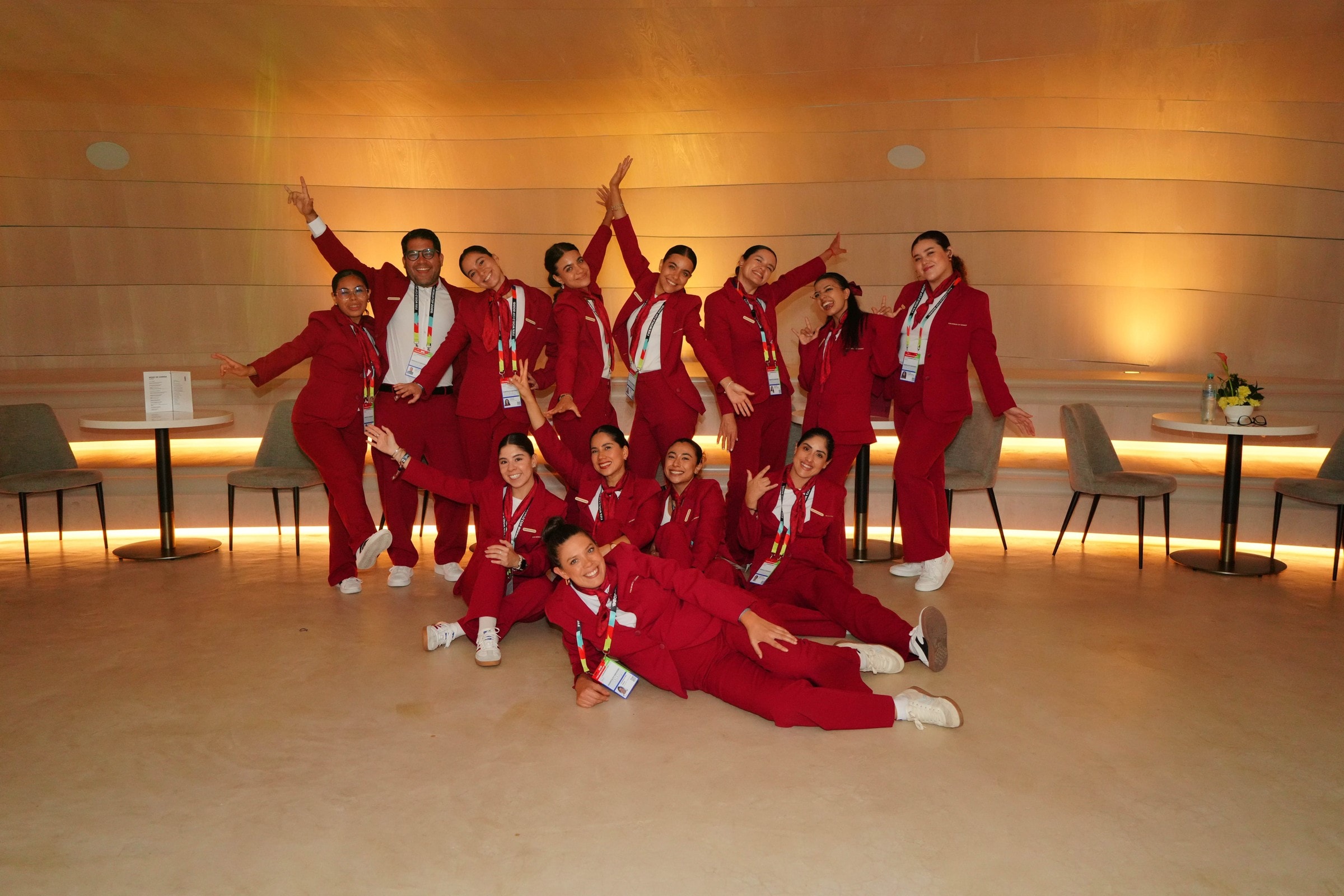 Event crew team in red uniforms at sports hospitality lounge