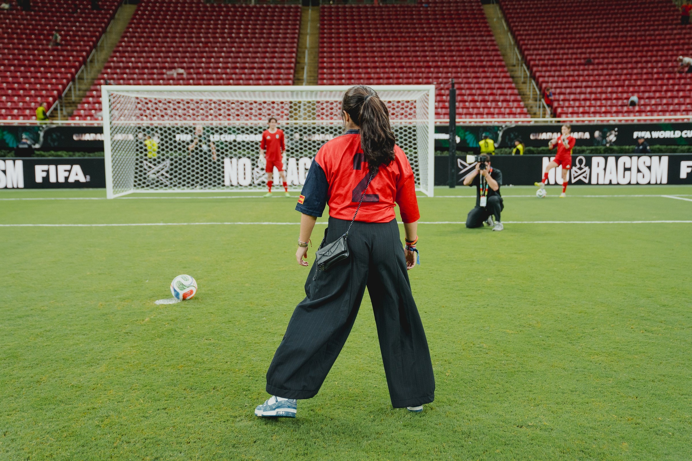 Woman on FIFA World Cup pitch at stadium