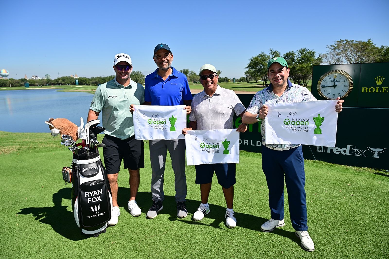 Pro-Am group with signed flags at Mexico Open